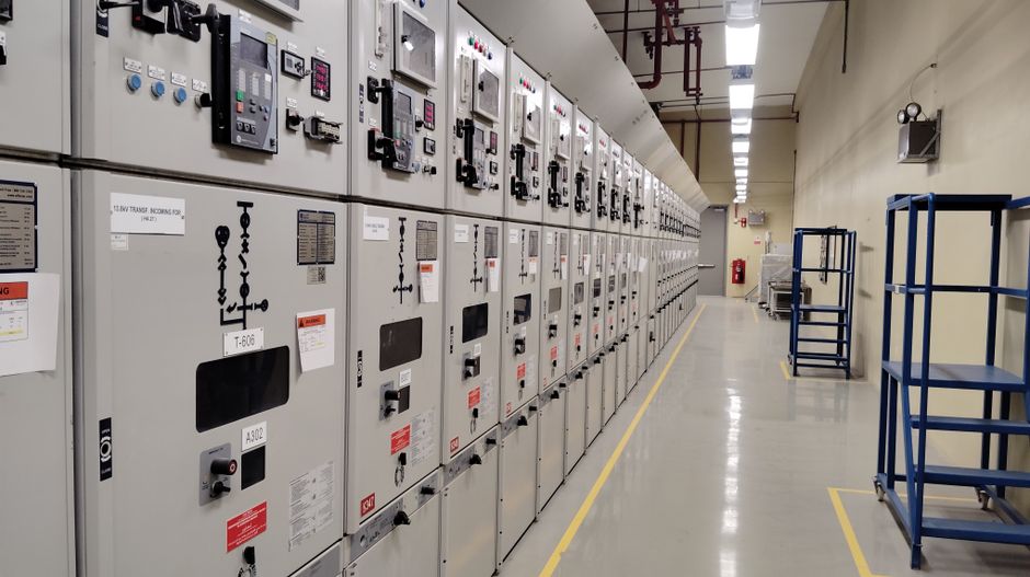 Medium-voltage electrical switchgear panels in a power distribution room