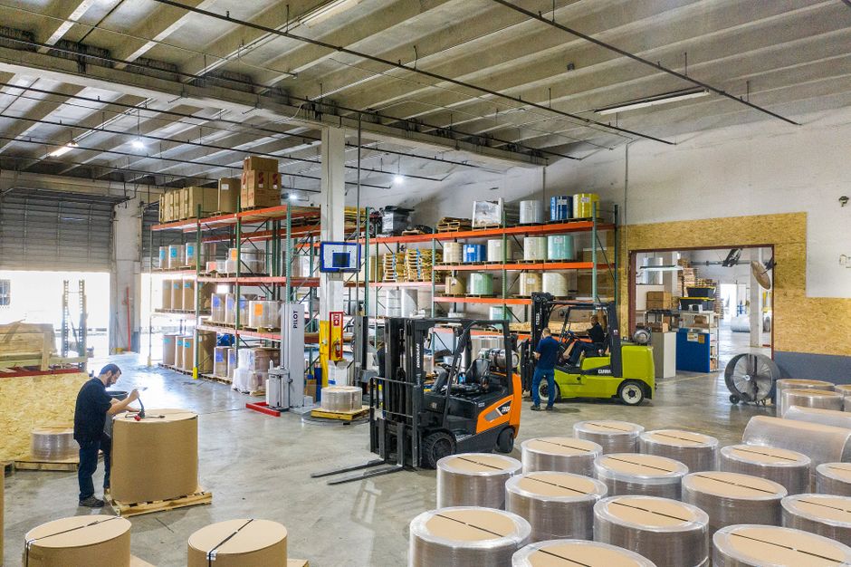 Hansol Paper stock note on inventory showing stored paper reels in a warehouse
