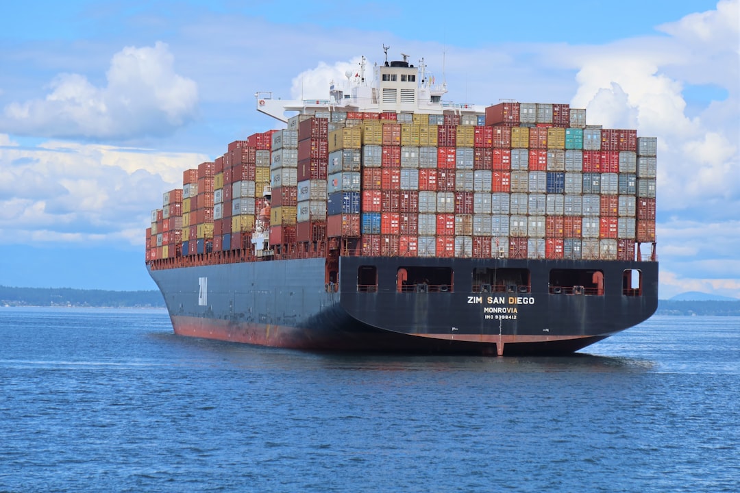 A loaded container ship underway at sea, the installed base a marine aftermarket serves