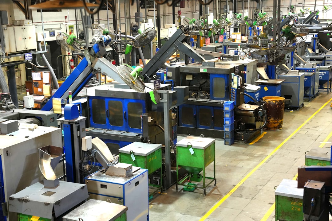 Injection molding machines lined up on a factory floor, illustrating the case-molding work behind Intops stock