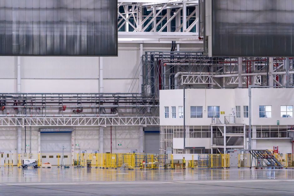 Korea Aerospace second-quarter results section image — interior of an aircraft assembly hangar (stock photo)