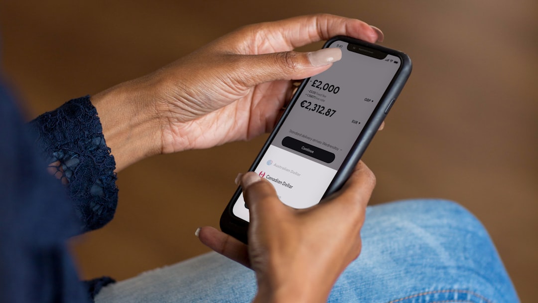 Cross-border money transfer app screen — the payments and remittance space a won stablecoin targets (generic image)