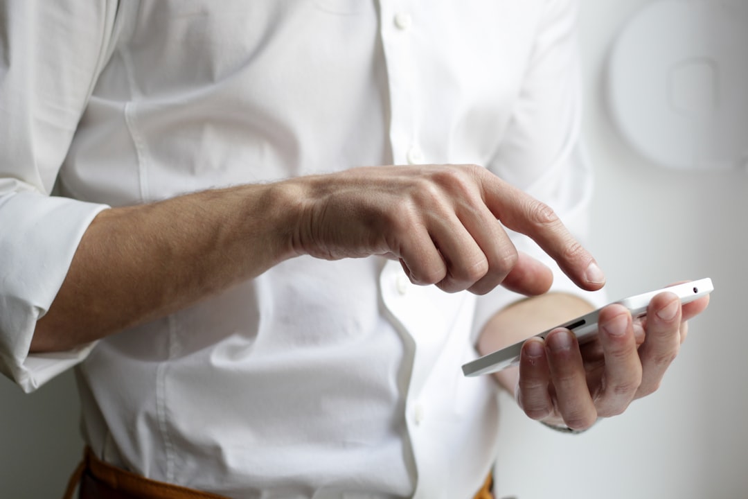 Person using a mobile banking app on a smartphone (generic image)