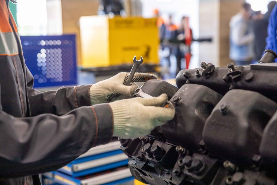Hyundai Elevator stock and the maintenance side of the elevator business — a service technician working on machinery