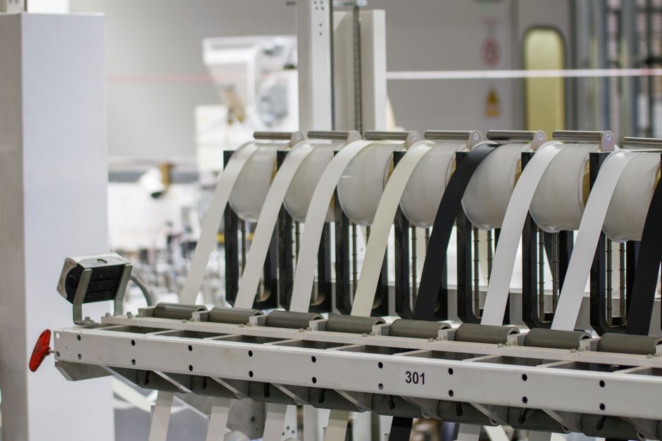 Nexen Tire stock analysis background showing a manufacturing line