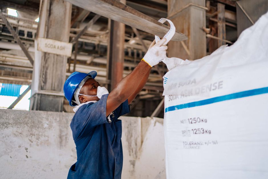 Worker handling bulk chemical material, used as in this POSCO Future M stock note
