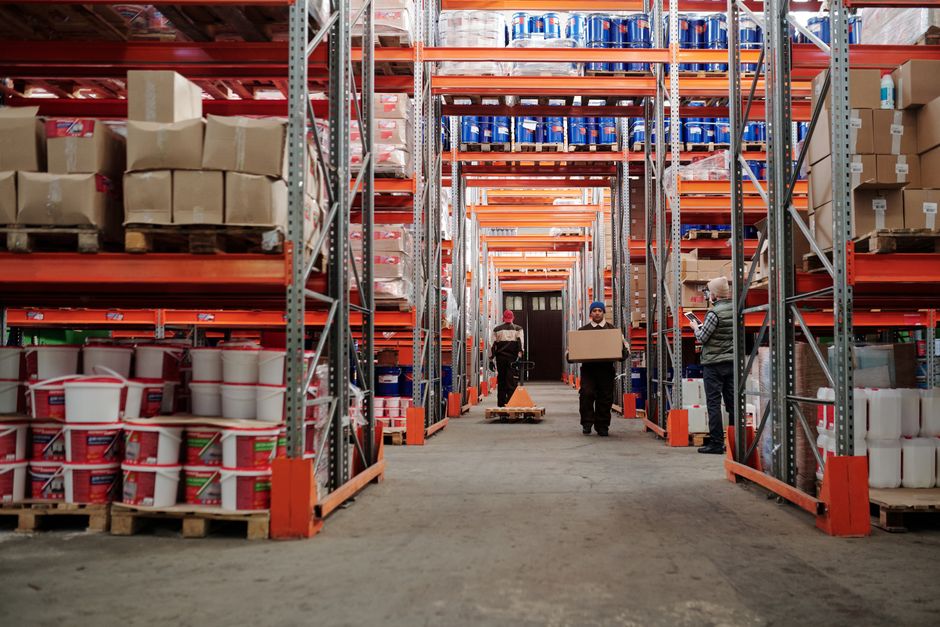 Warehouse distribution center aisle with pallet racking and material handling