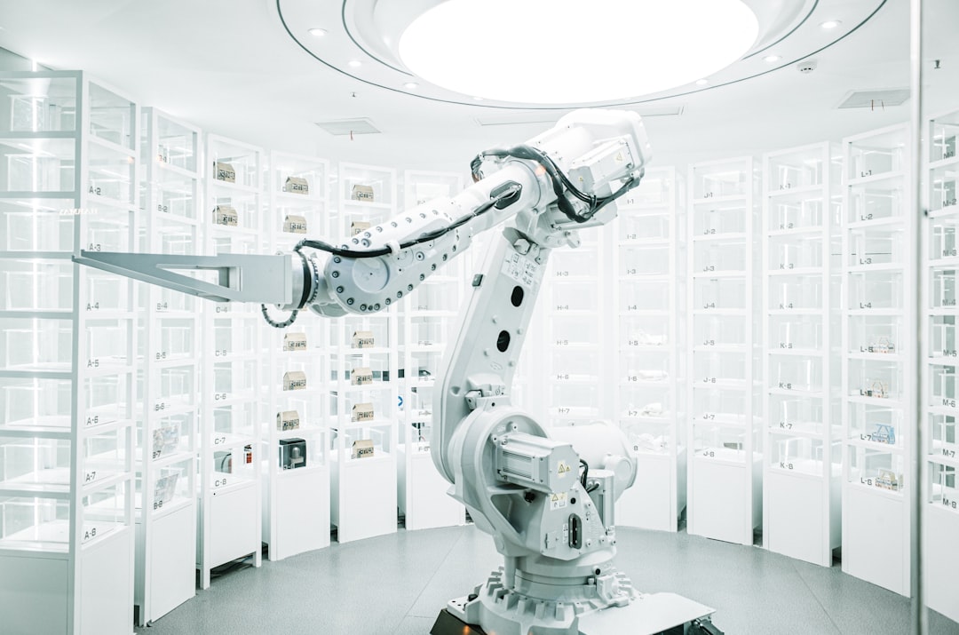 Robotic arm retrieving items from automated storage racking