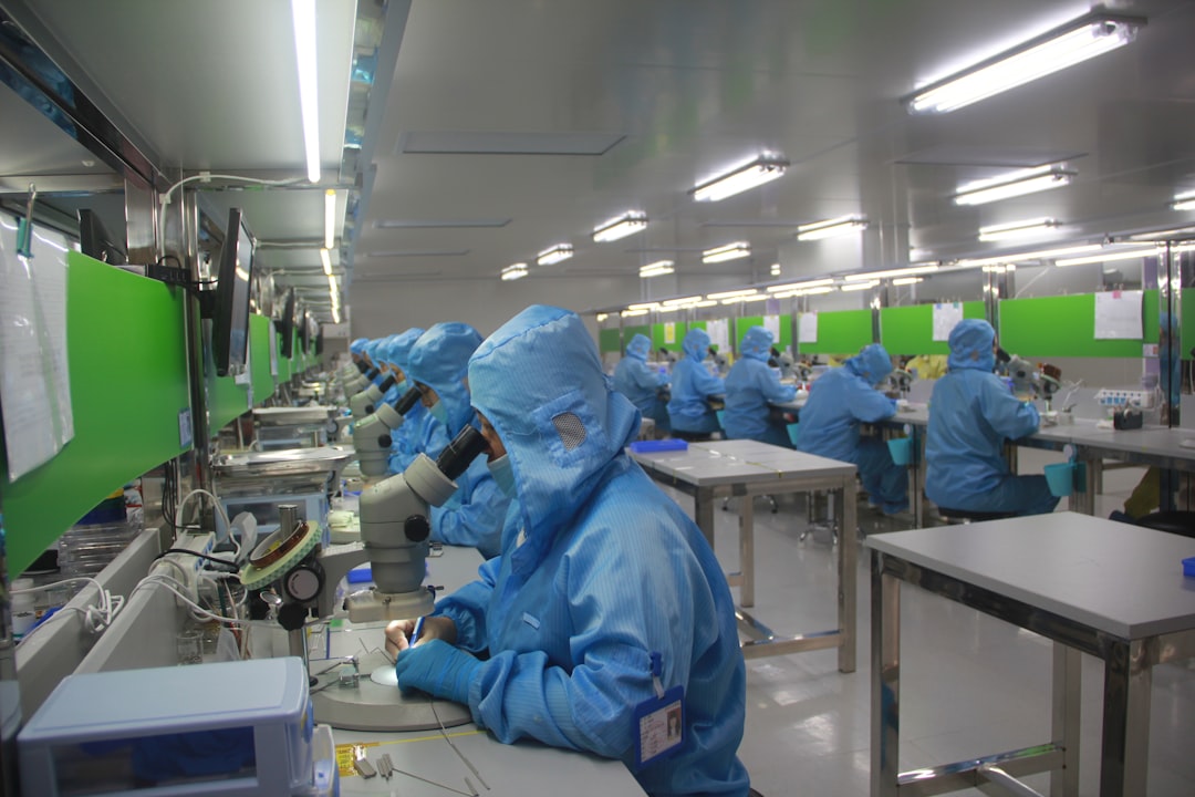 Cleanroom bench where optical modules are inspected under microscopes
