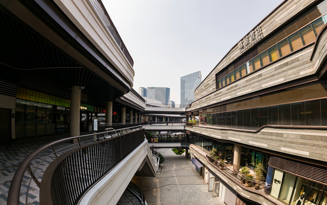 Shop fronts along a retail complex, the kind of property income behind BYC stock
