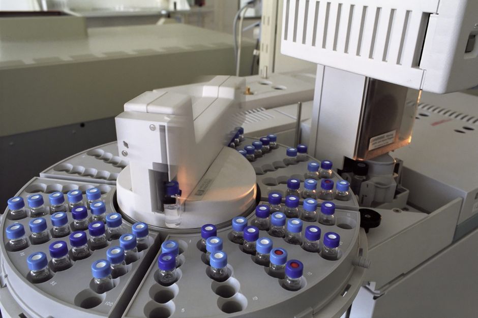 Glass vials loaded on an automated laboratory autosampler, from a Daewoong Pharmaceutical stock review