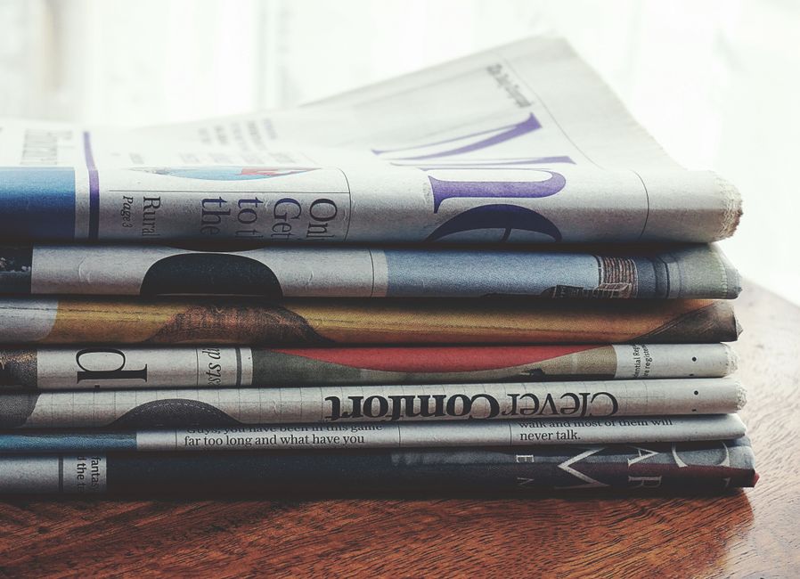 Business headlines of the kind that produced the reading behind this DL E&C entry