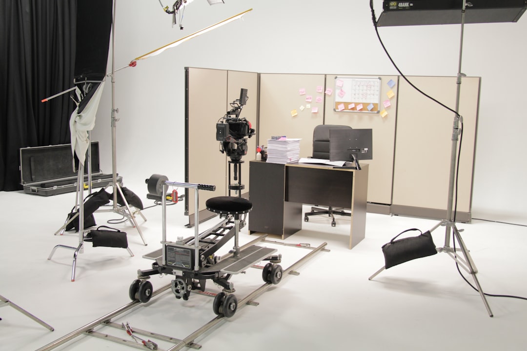 A television studio set with a camera dolly and lighting rig, an illustration for the GS Retail stock segment discussion