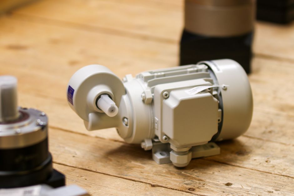 HIGEN RNM stock seen through an industrial motor on a factory floor