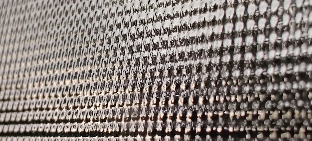 Close view of a woven technical fabric accompanying Hyosung Advanced Materials stock coverage