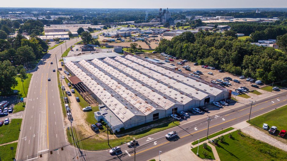 Hwashin stock and a single-storey factory plant in the American South
