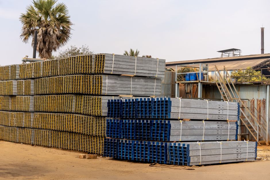 Construction supply inventory stacked at a yard, standing in for the building materials business