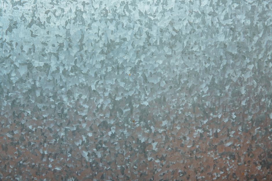 KG Steel stock file: close view of a galvanized steel sheet surface