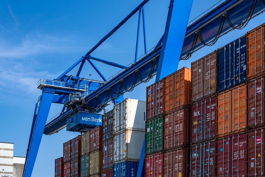 Port crane loading cargo at an export terminal