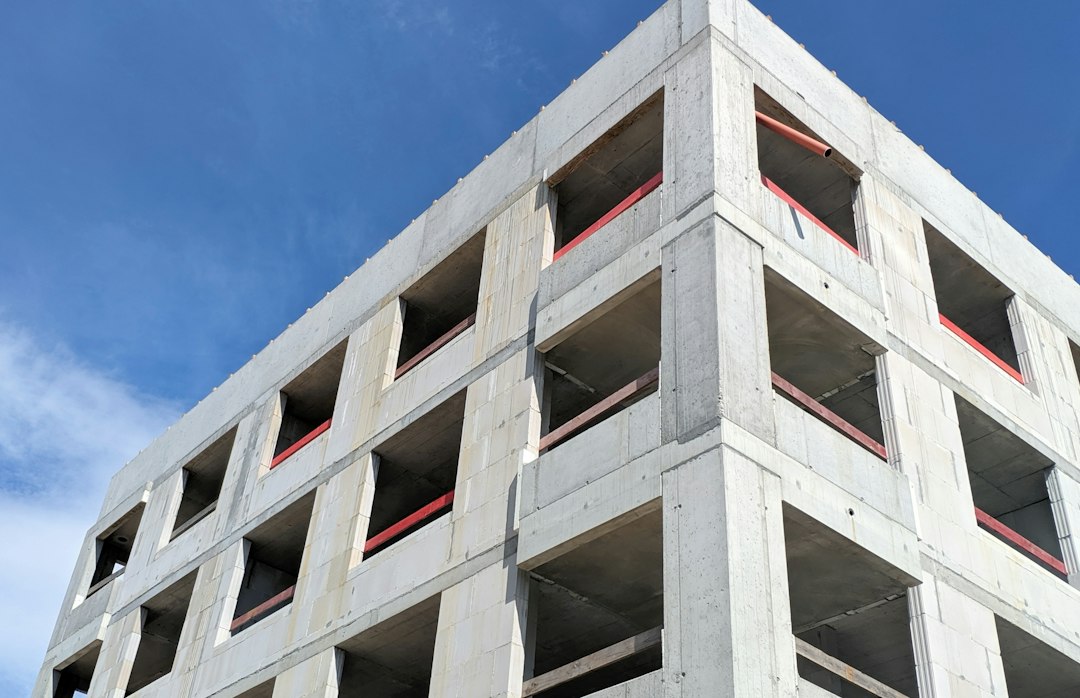 Kolon Global stock and a concrete building frame under construction