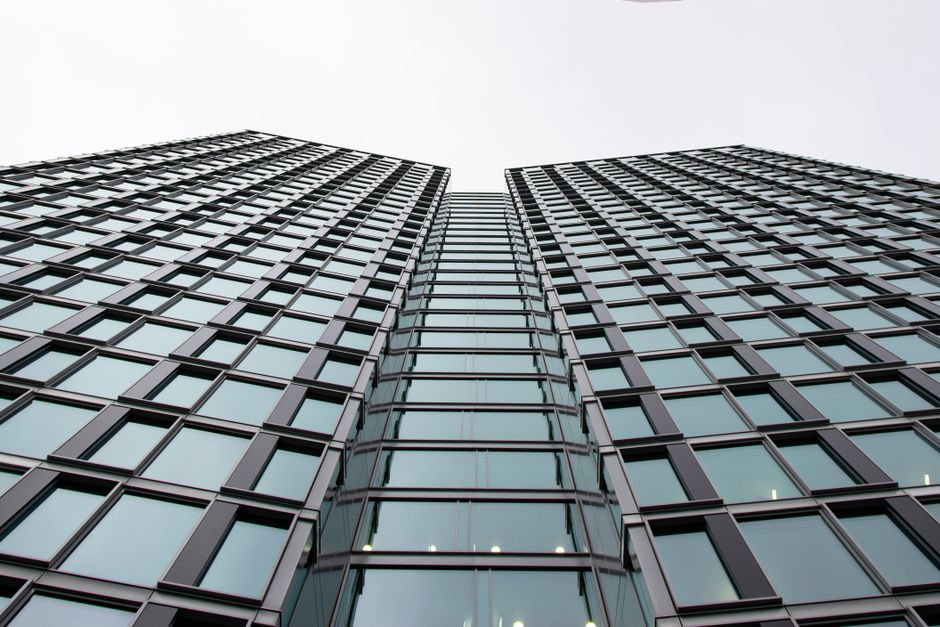 NHN stock analysis illustration showing a Korean software company office tower