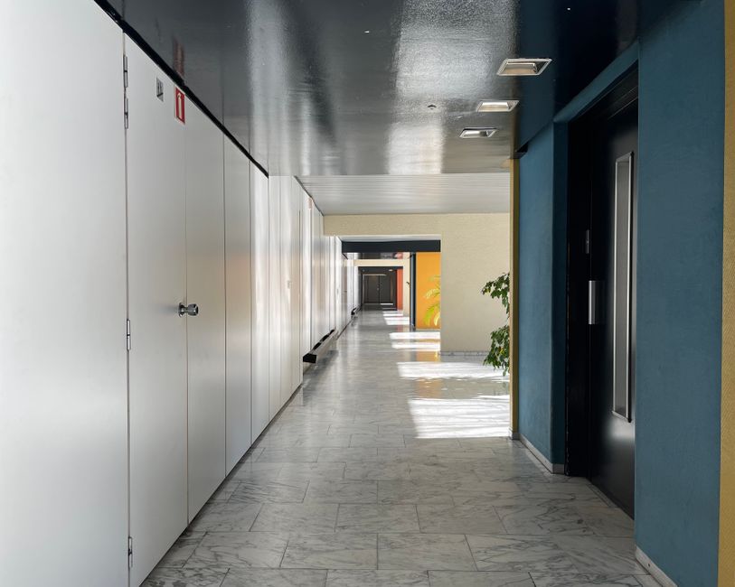 A quiet corridor that stands in for the office economics behind NICE Information Service stock