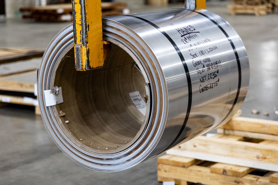 A roll of thin metal sheet, standing in for the inventory line behind Sam-A Aluminium stock