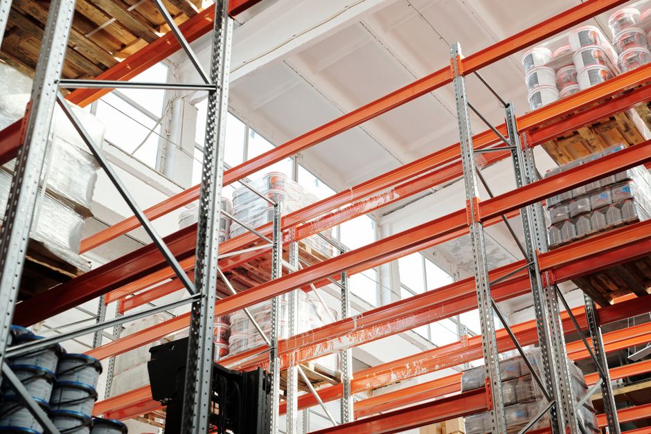 Warehouse shelving of the kind that holds inventory built ahead of delivery