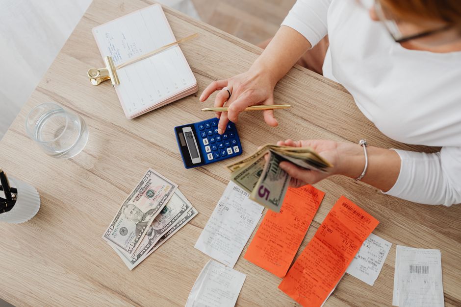 Paper receipts spread on a table, the consumer spending behind Samsung Card stock