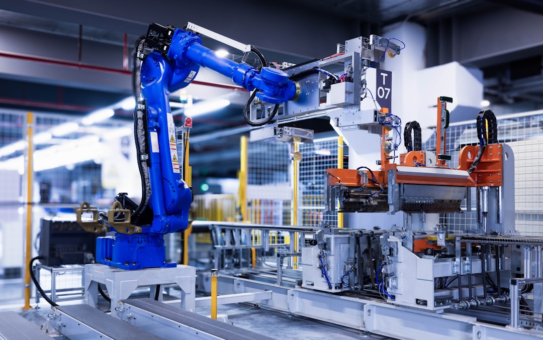 SPG Co stock context image of industrial robot arms on a production line