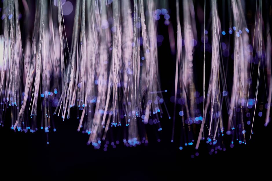 Close view of optical fiber strands carrying light