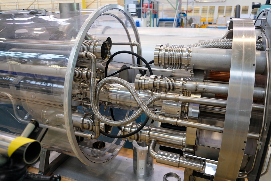 Vacuum process chamber on an equipment assembly floor, shown alongside this Wonik QnC revenue record