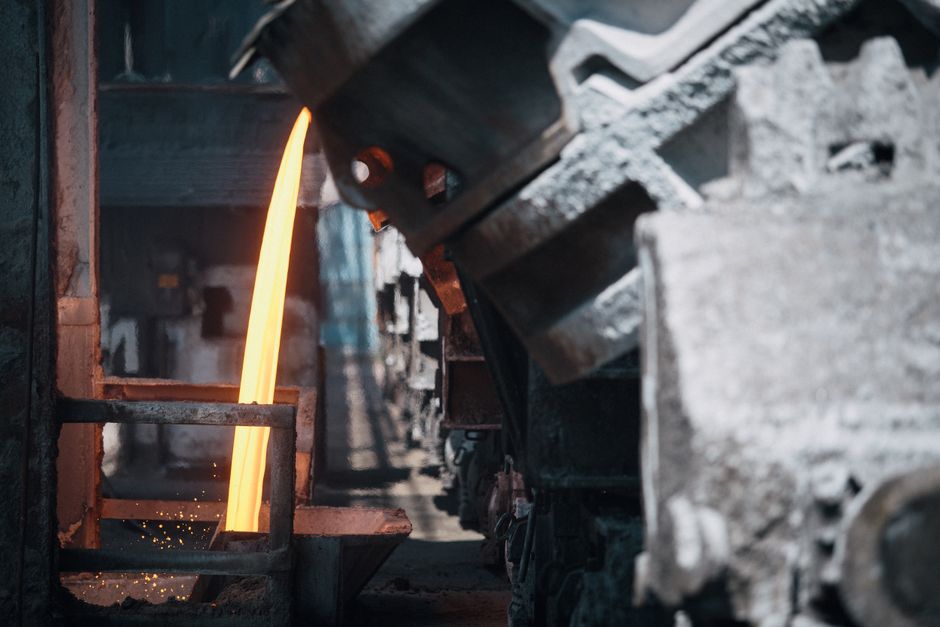 Molten metal pours inside a smelting plant of the kind that anchors Young Poong stock