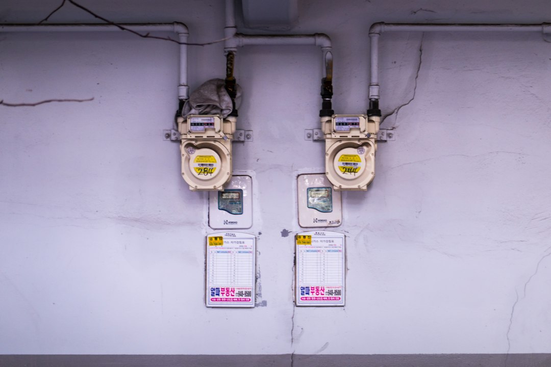 Wall-mounted gas meters illustrating the Samchully share retirement piece